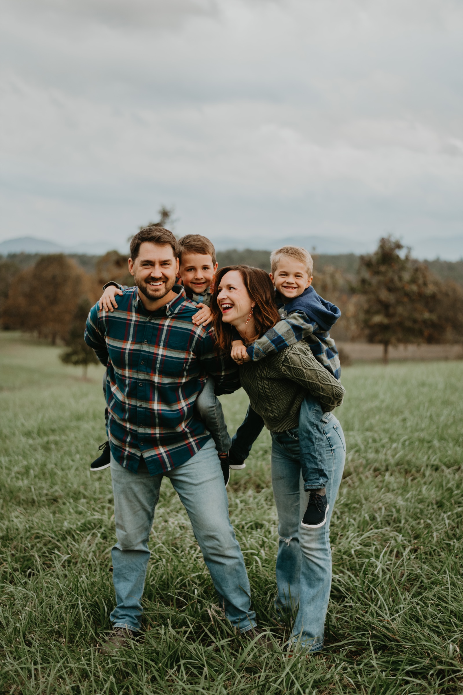 A family connecting naturally during their fall session